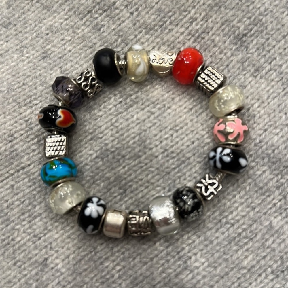 Multiple charmed silver bracelet